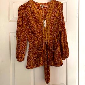 Perfect for fall- pretty blouse with the front